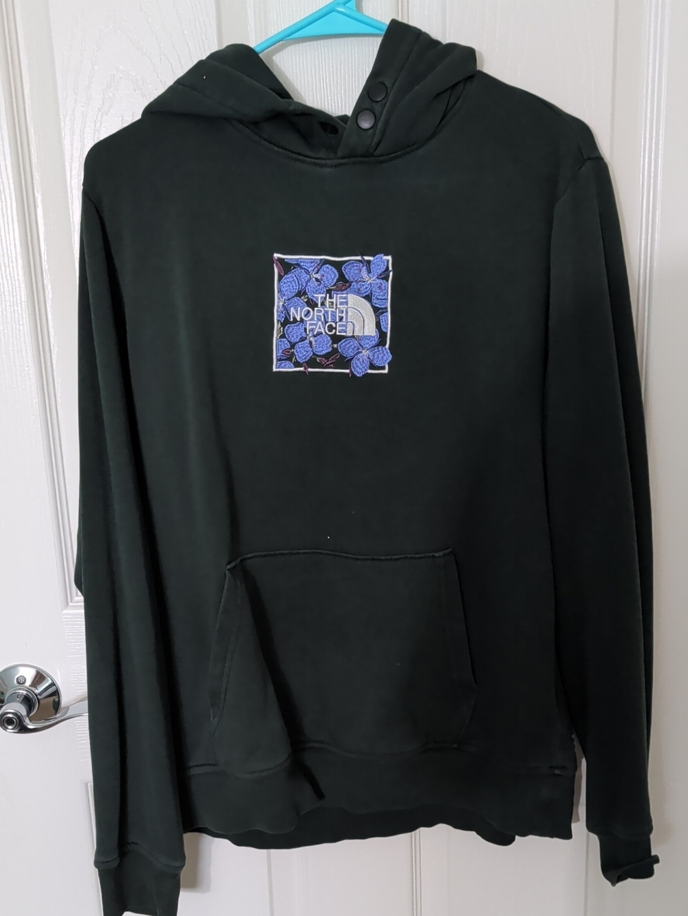 The North Face Men's Black Hoodie with Blue Logo Patch